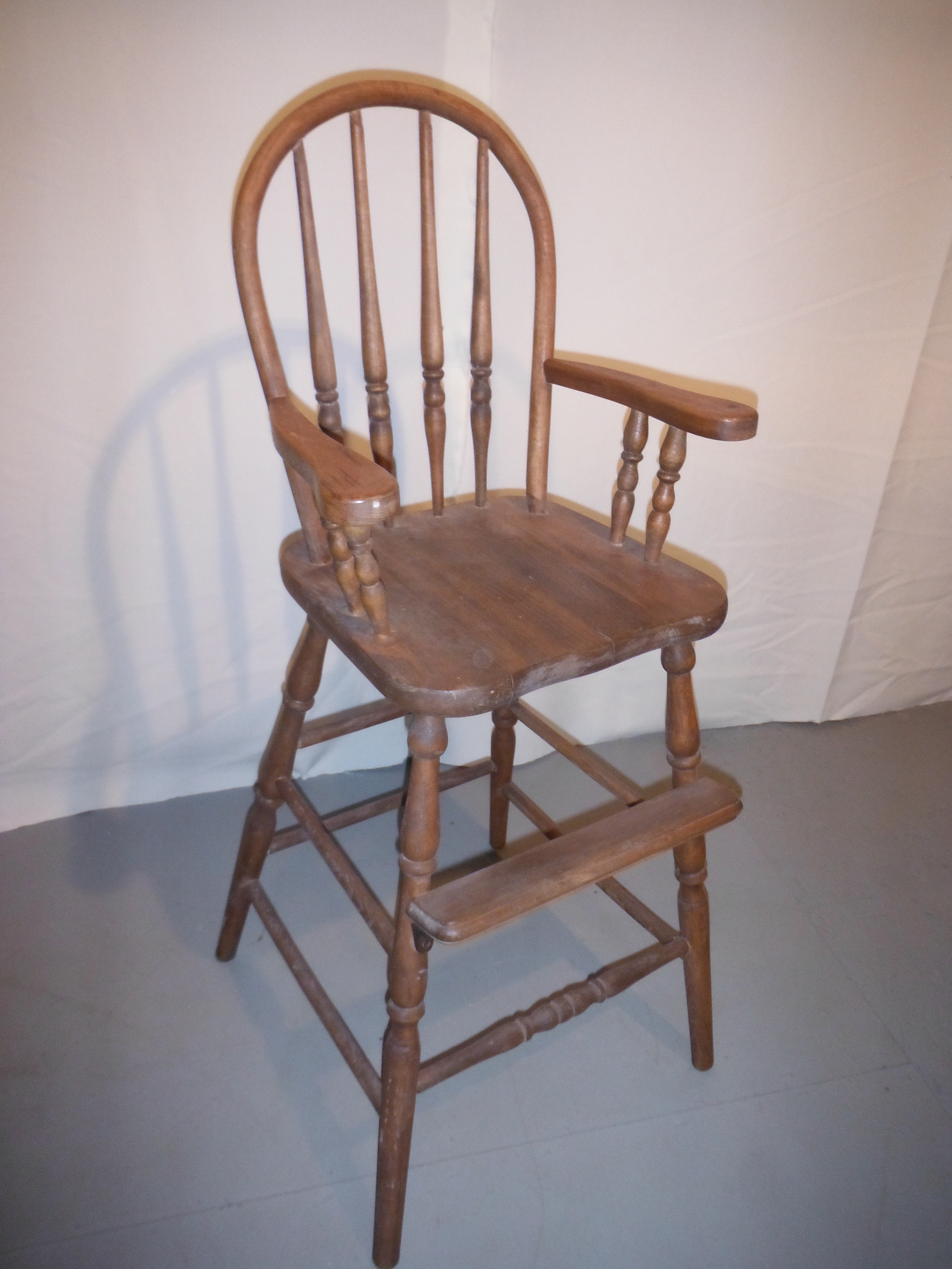 antique wooden high chair with wheels
