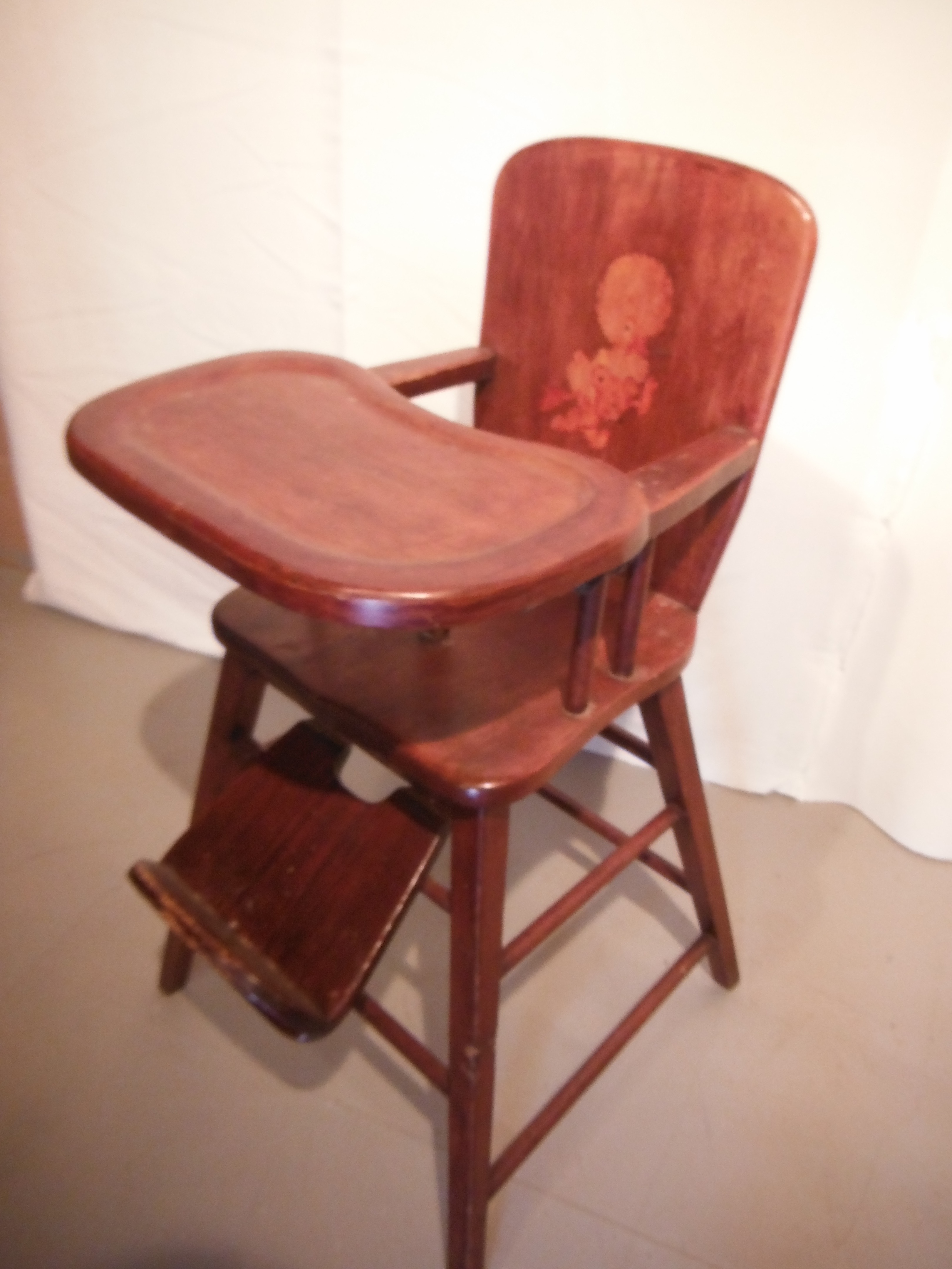 antique wooden high chair with metal tray